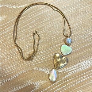 Brand new. Long heart necklace.